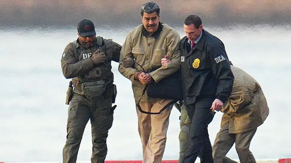 Nicolás Maduro being escorted by DEA agents following his capture